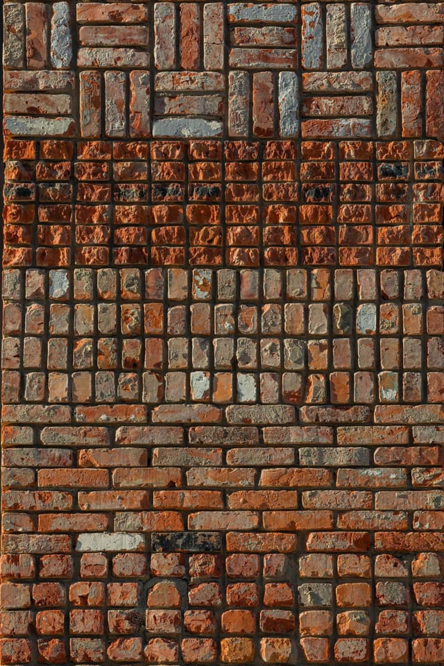 Recycled bricks laid in different patterns and surface textures