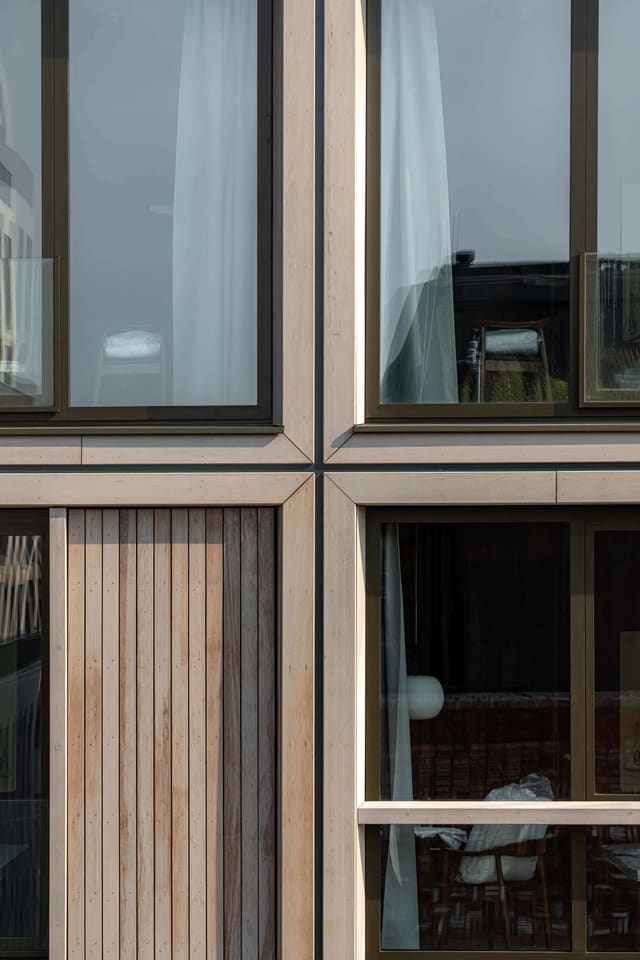 Close-up of the timber facade panels of the apartment-hotel